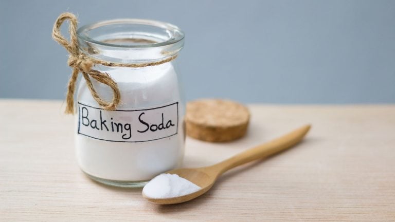 photo showing a glass of baking soda - for does baking soda kill weeds post on the SunCo blog